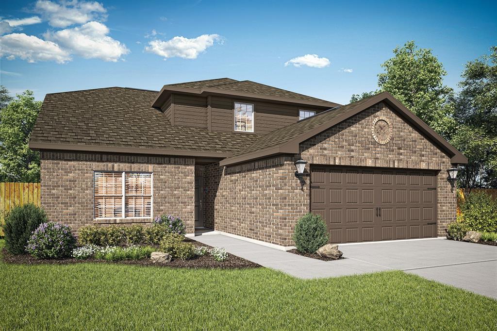 a front view of a house with a garden and plants