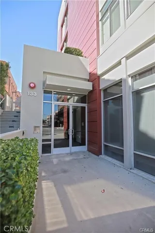 a view of a building with potted plants