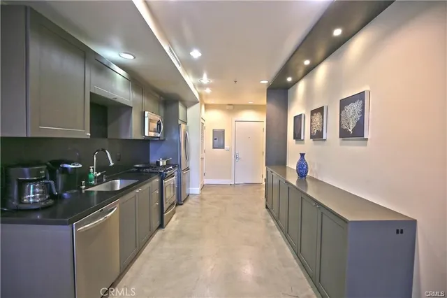 a large kitchen with stainless steel appliances