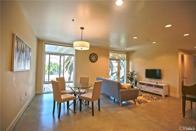 a view of a livingroom with furniture window and wooden floor