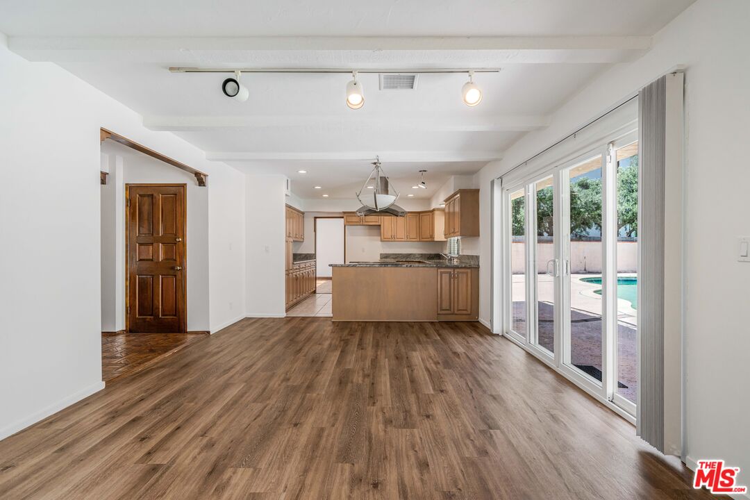 1181 Somera Road Los Angeles, CA 90077 - Photo 9 of 40 a view of a kitchen with wooden floor a sink and windows