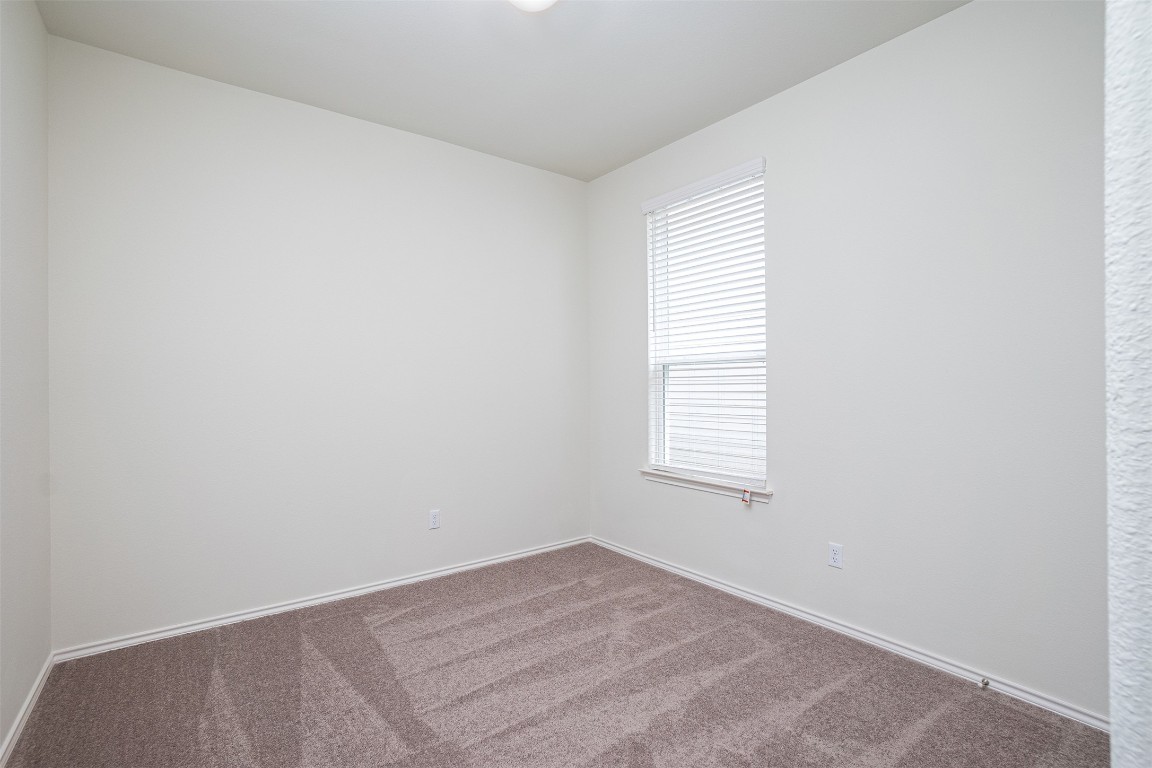 237 Yellowbark Street Buda, TX 78610 - Photo 10 of 28 an empty room with a window