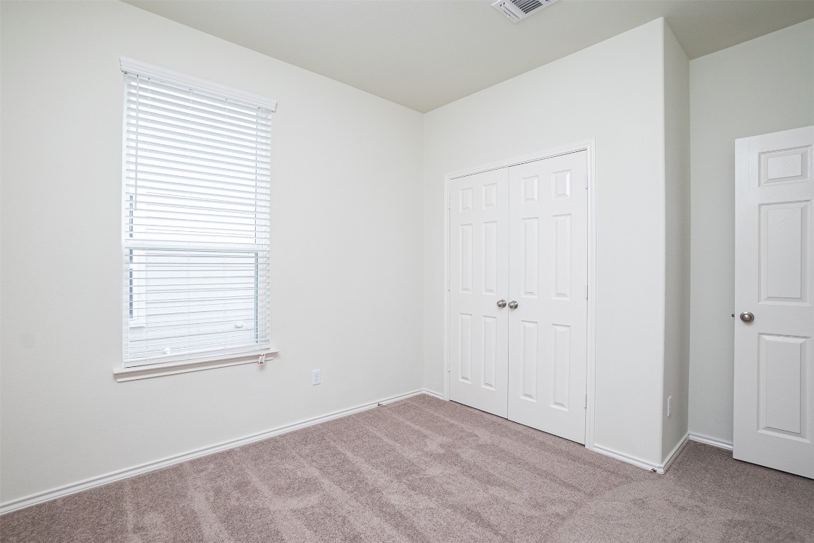 237 Yellowbark Street Buda, TX 78610 - Photo 12 of 28 a view of an empty room with closet area