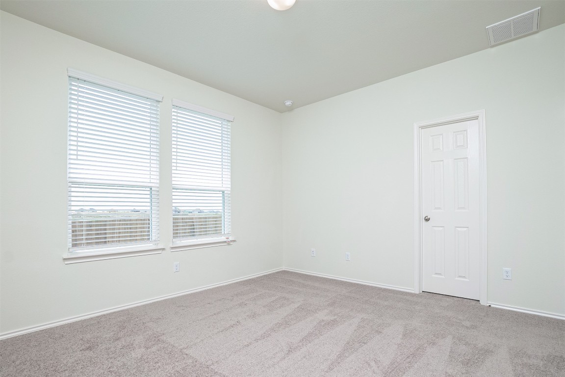 237 Yellowbark Street Buda, TX 78610 - Photo 16 of 28 an empty room with a window