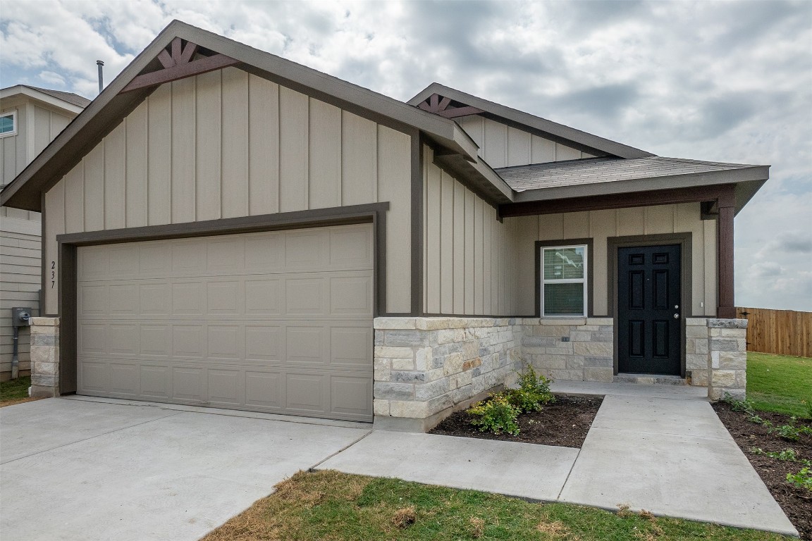 237 Yellowbark Street Buda, TX 78610 - Photo 3 of 28 a front view of a house with garden