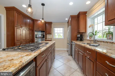 a dining room with furniture and a clock