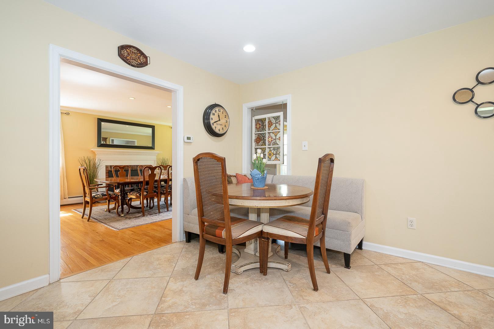 421 Wister Road Wynnewood, PA 19096 - Photo 13 of 53 a dining room with furniture and a clock
