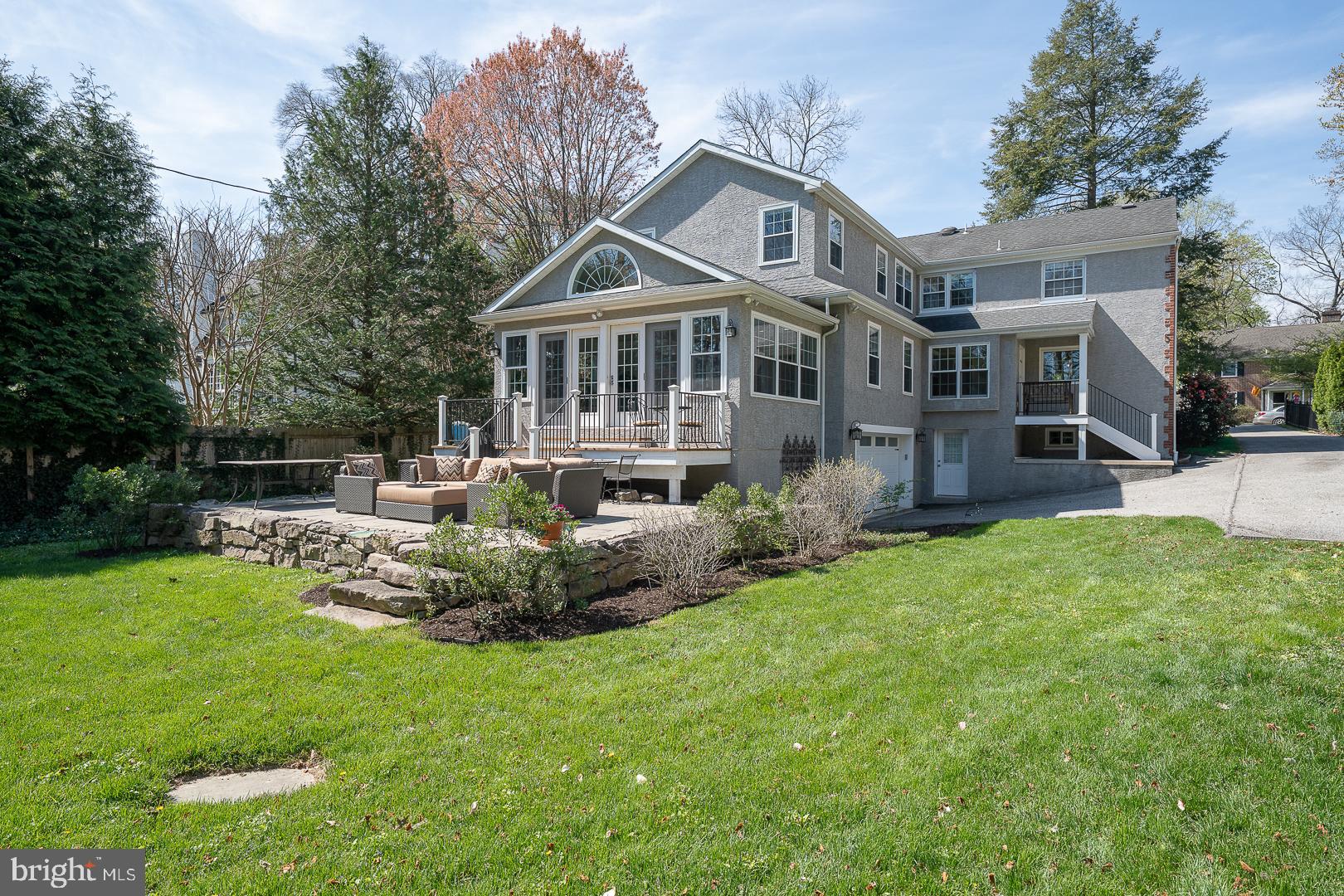 421 Wister Road Wynnewood, PA 19096 - Photo 2 of 53 a front view of a house with a garden and trees