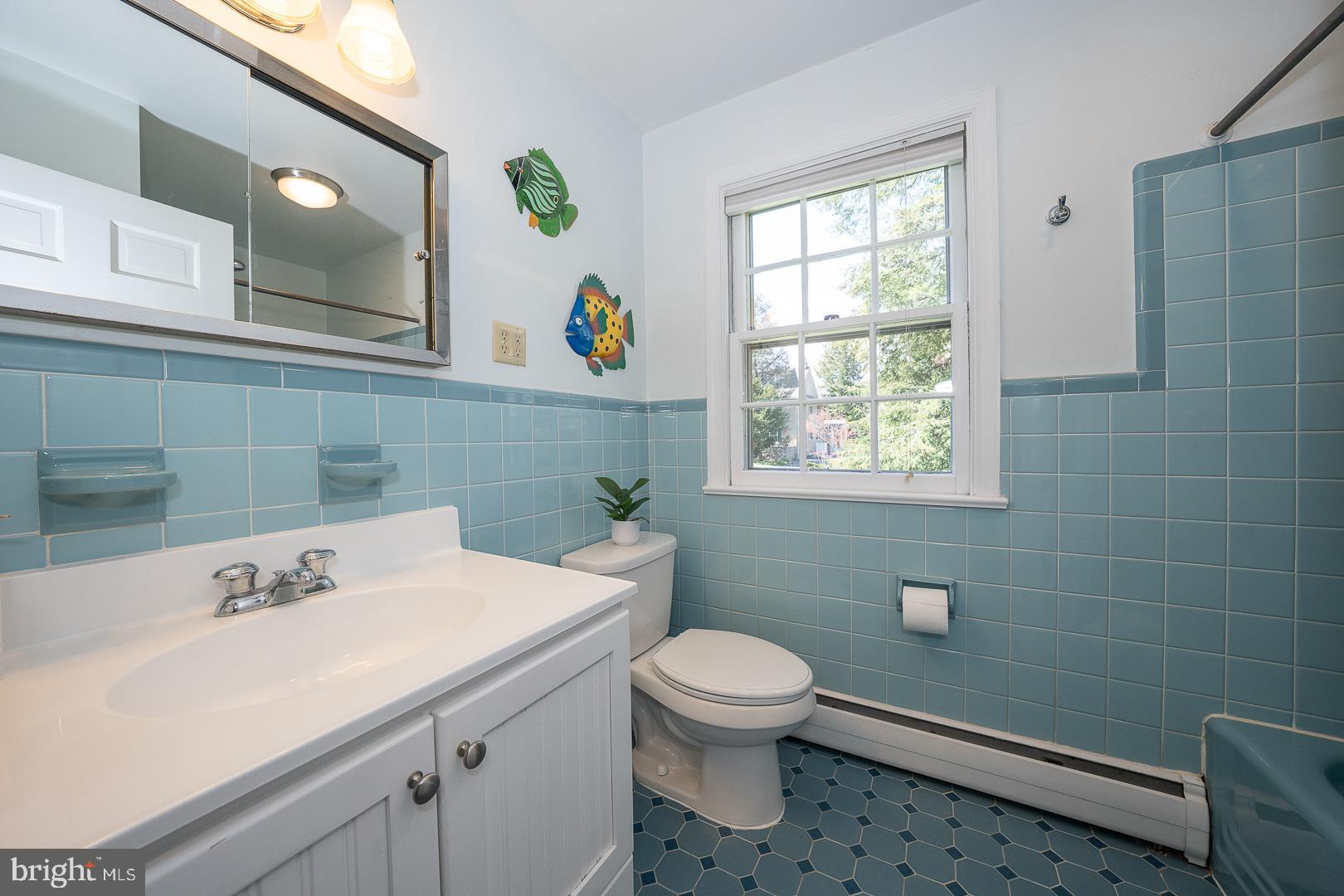 421 Wister Road Wynnewood, PA 19096 - Photo 36 of 53 a bathroom with a sink a toilet and a window