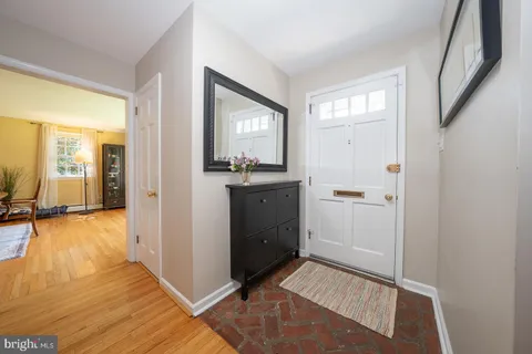 a room with a bed and a view of kitchen