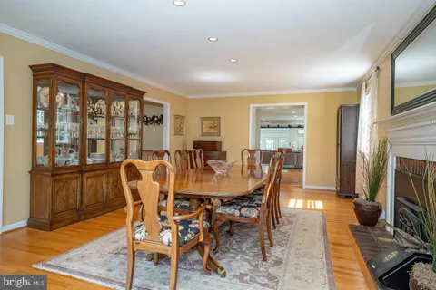 a kitchen with kitchen island granite countertop a sink a center island and stainless steel appliances
