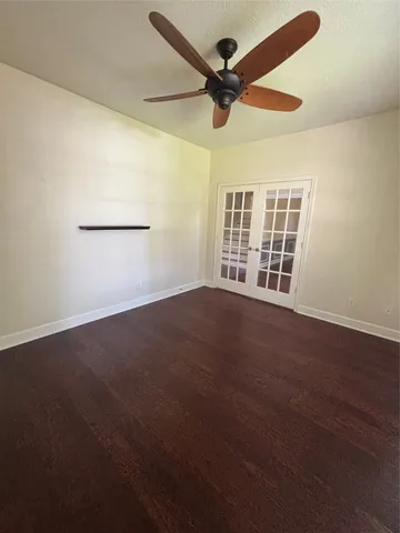 a kitchen with granite countertop white cabinets and sink