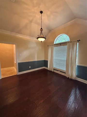 a kitchen with kitchen island granite countertop a sink a counter top space appliances and cabinets