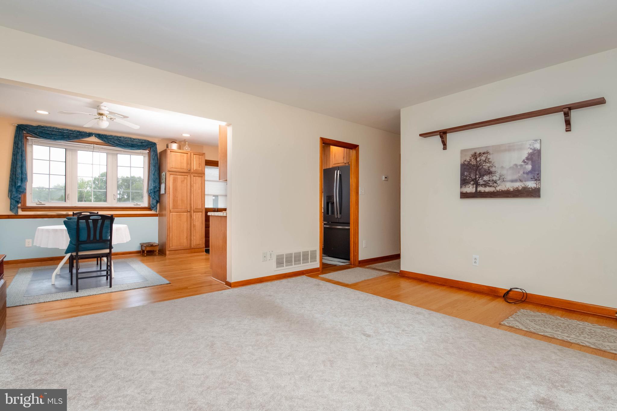 2319 Reckord Road Joppa, MD 21085 - Photo 4 of 45 an empty room with furniture and a floor to ceiling window