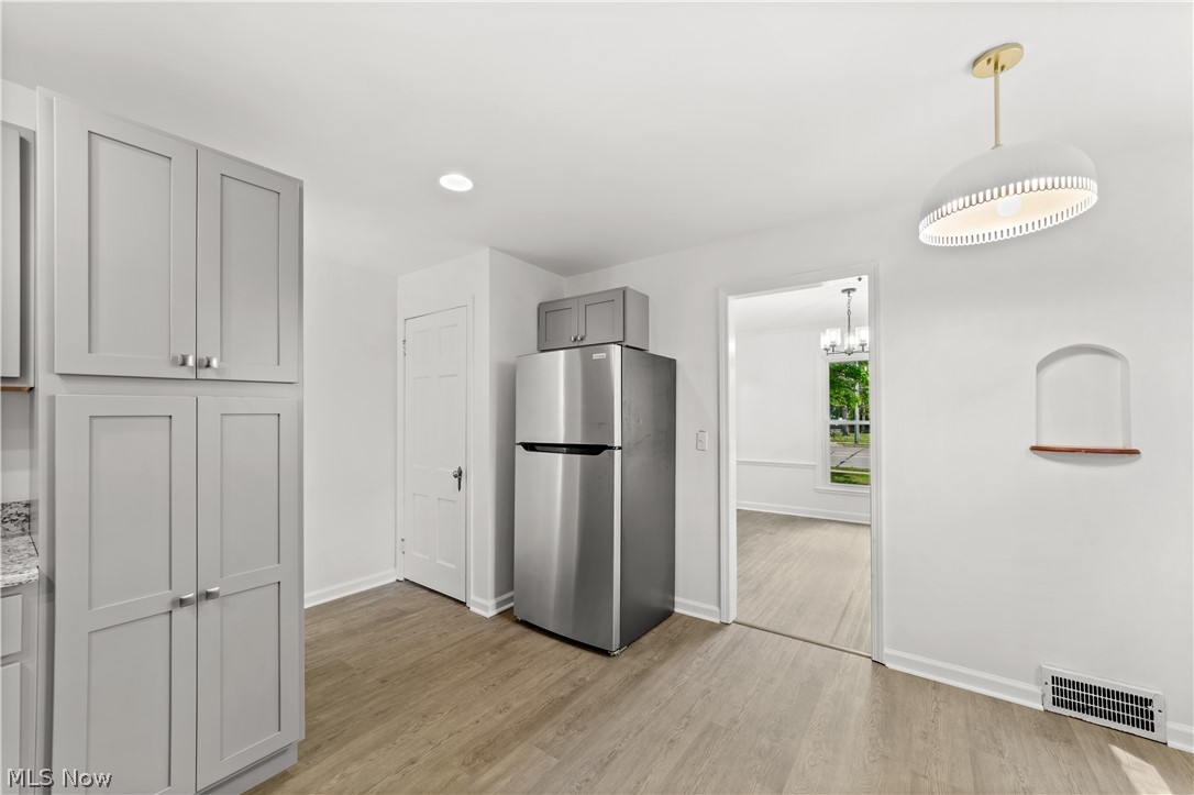 6444 Wilson Mills Road Cleveland, OH 44143 - Photo 6 of 29 Beautifully Updated Kitchen with New Cabinets, Counters, Stainless Steel Appliances, Flooring and Lighting