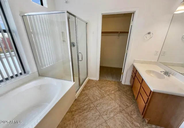 a bathroom with a sink a mirror and a tub