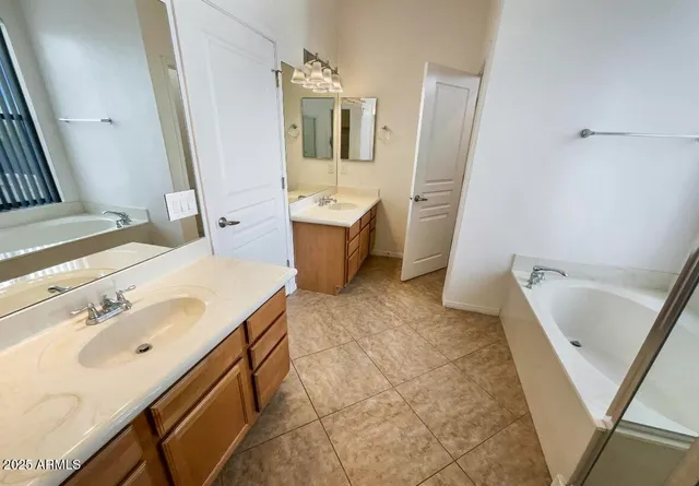 a bathroom with a sink a vanity and a mirror