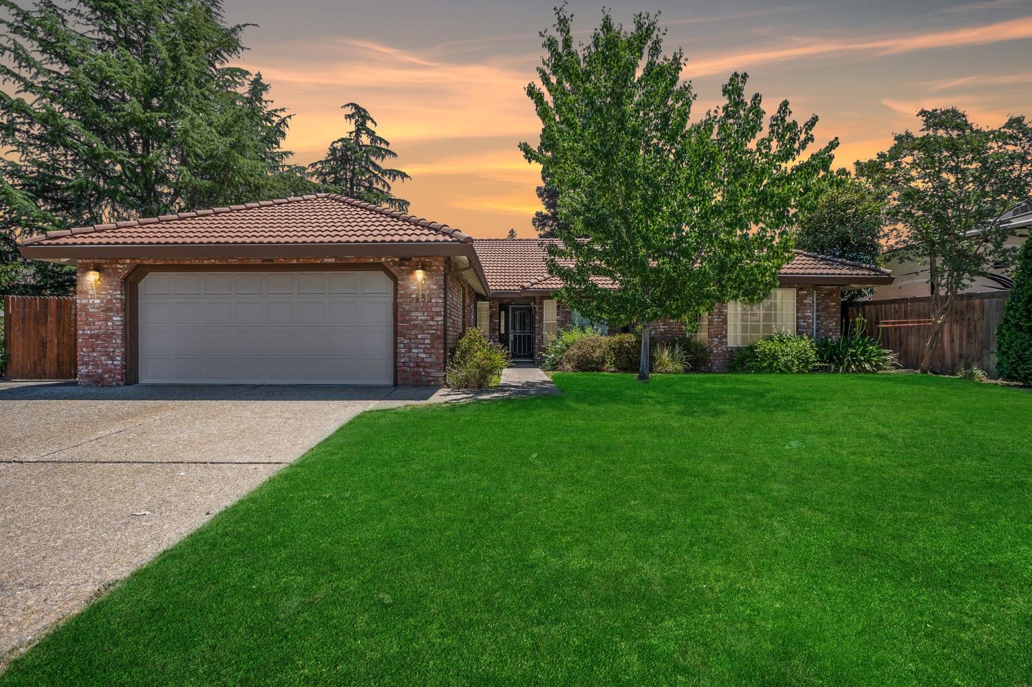 a front view of house with garden