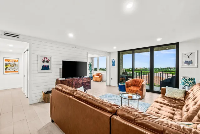 a living room with furniture and a rug