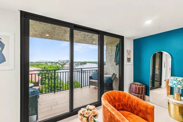 a room with furniture and paintings on the wall