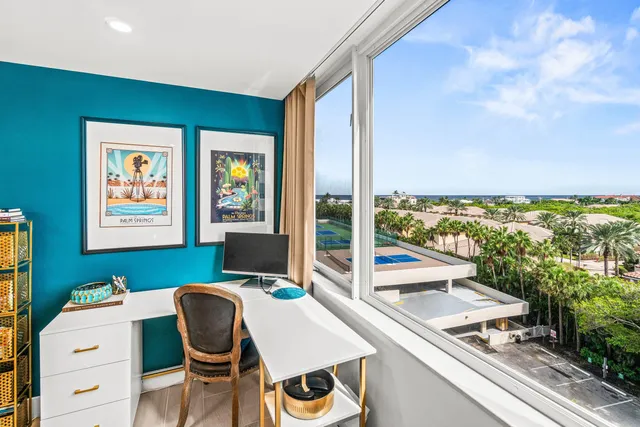 a view of a balcony with chair and table