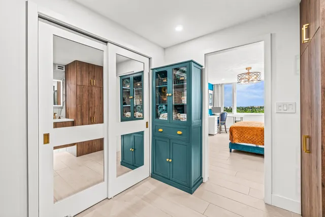 a bathroom with a sink vanity mirror and toilet
