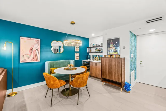 a dining room with furniture and window