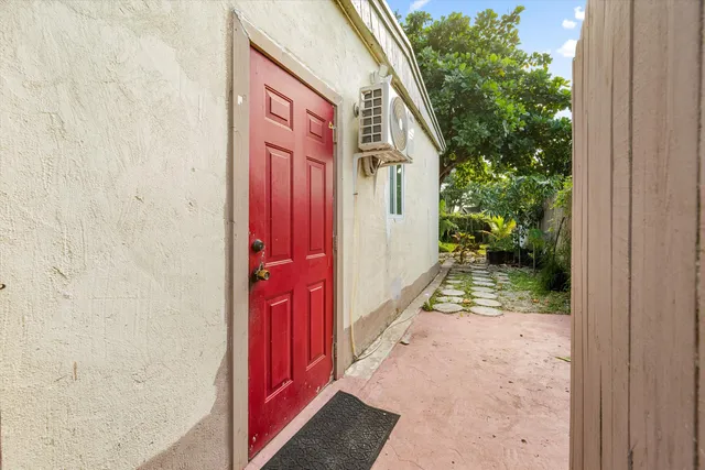 a view of a pathway of a house with backyard