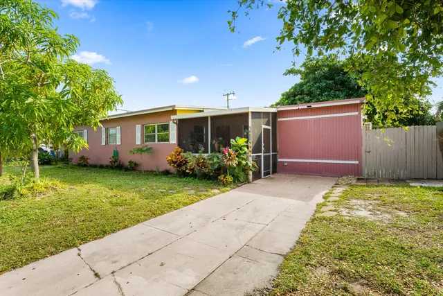 a front view of house with garden