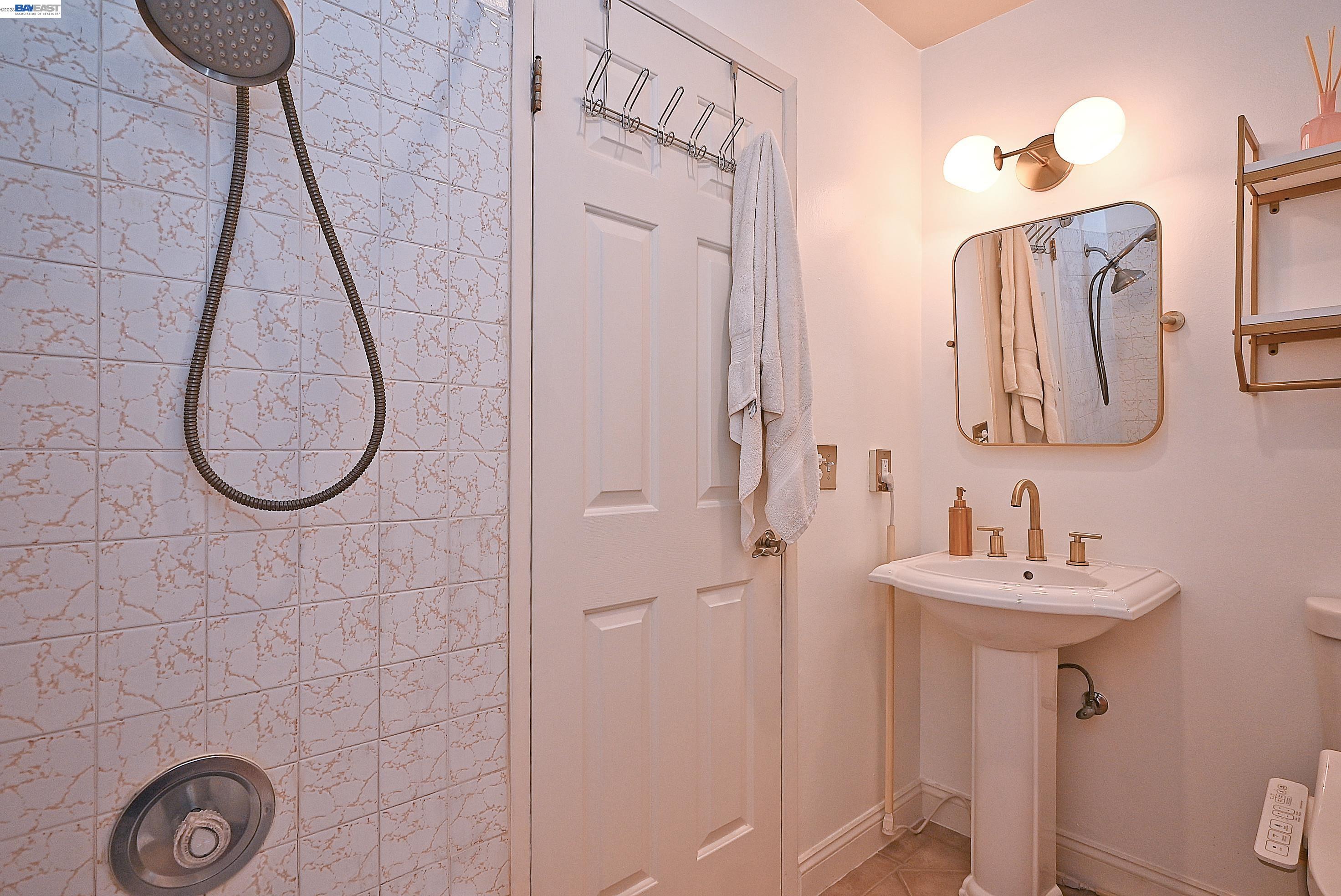 960 Shorepoint Court, Unit 215 Alameda, CA 94501 - Photo 13 of 22 a bathroom with a sink and a mirror