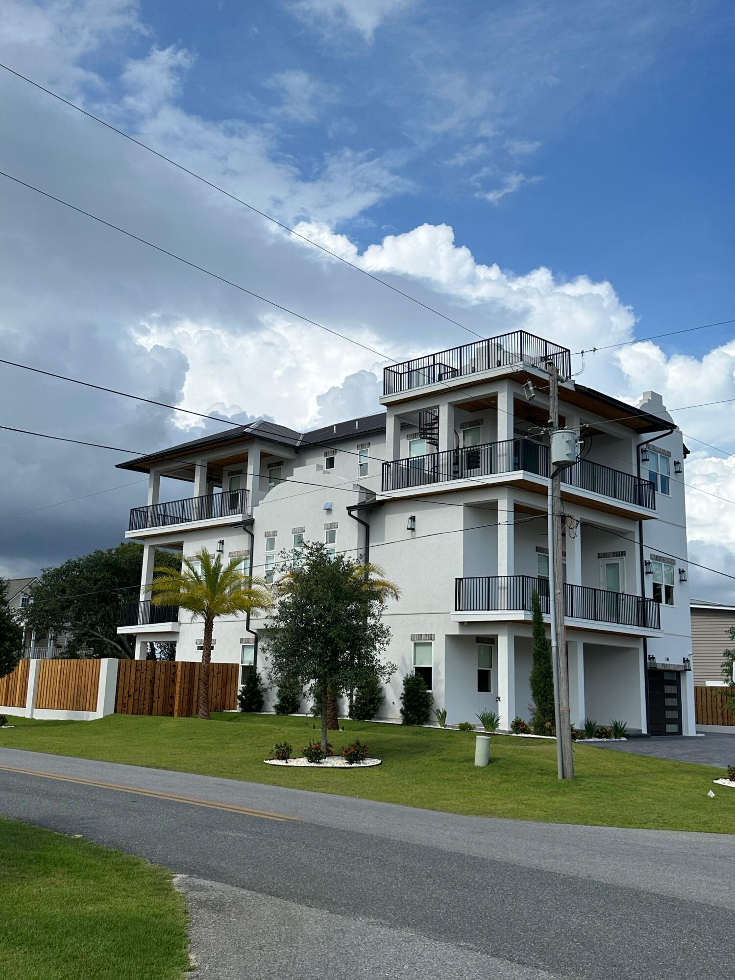 141 Maple Street Santa Rosa Beach, FL 32459 - Photo 2 of 11 a front view of a house with a garden