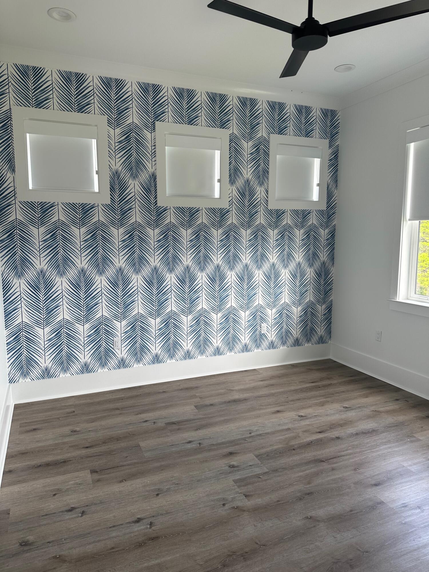 141 Maple Street Santa Rosa Beach, FL 32459 - Photo 7 of 11 a view of room with window and hardwood floor