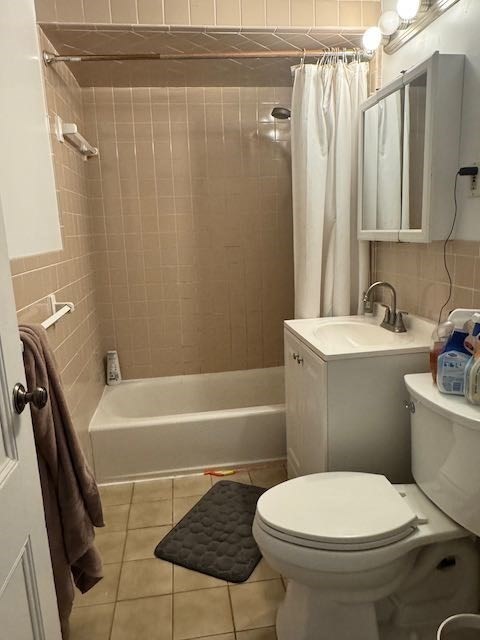 43 Sydney Street, Unit 2 Boston, MA 02125 - Photo 18 of 28 a white toilet sitting next to a bath tub