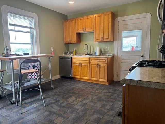 43 Sydney Street, Unit 2 Boston, MA 02125 - Photo 3 of 28 a kitchen with a stove a sink and a refrigerator