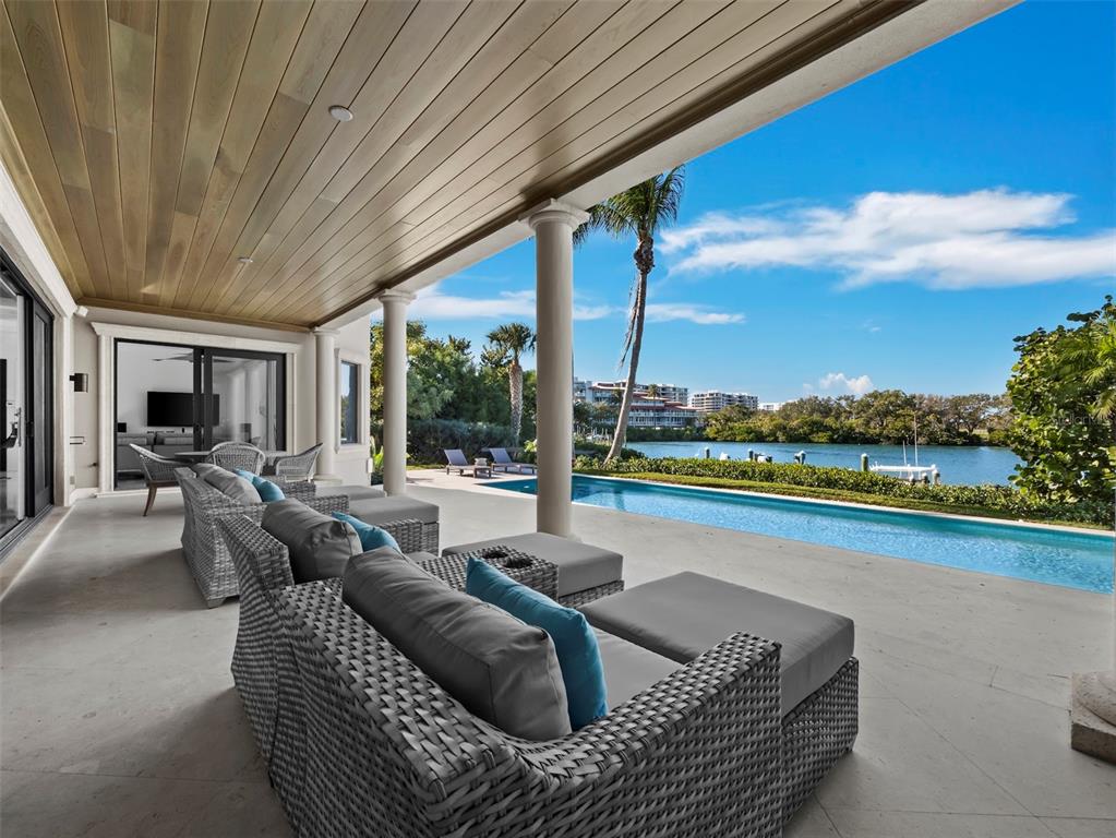 65 Lighthouse Point Drive Longboat Key, FL 34228 - Photo 14 of 90 a outdoor living space with furniture and garden view