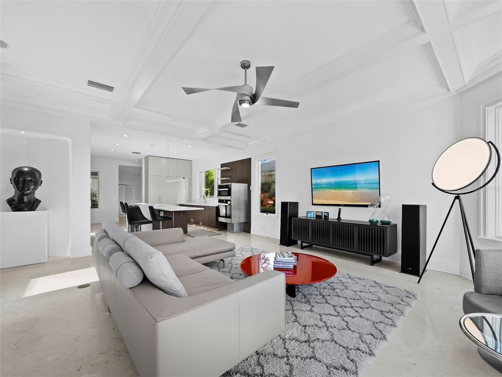 65 Lighthouse Point Drive Longboat Key, FL 34228 - Photo 18 of 90 a living room with furniture and a flat screen tv