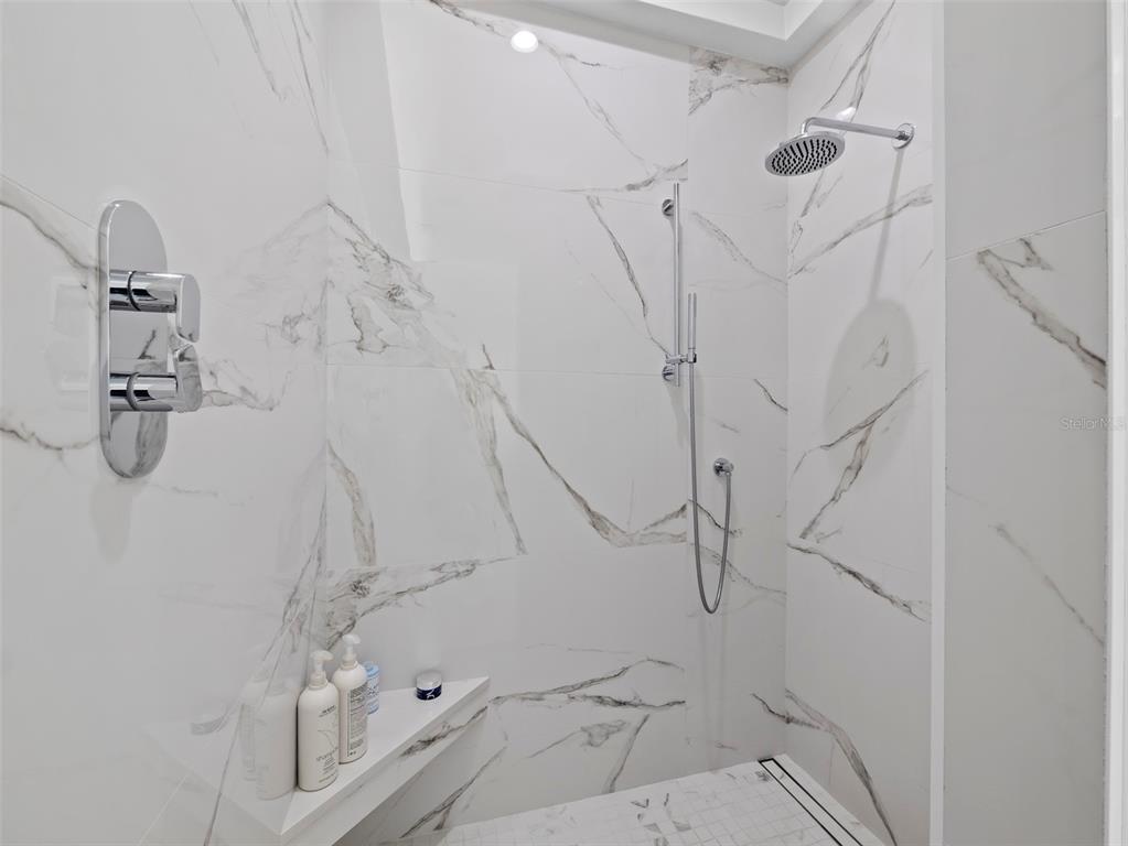 65 Lighthouse Point Drive Longboat Key, FL 34228 - Photo 31 of 90 a bathroom with a shower