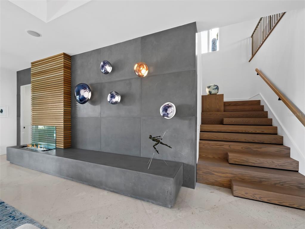 65 Lighthouse Point Drive Longboat Key, FL 34228 - Photo 36 of 90 a view of a livingroom with furniture and staircase