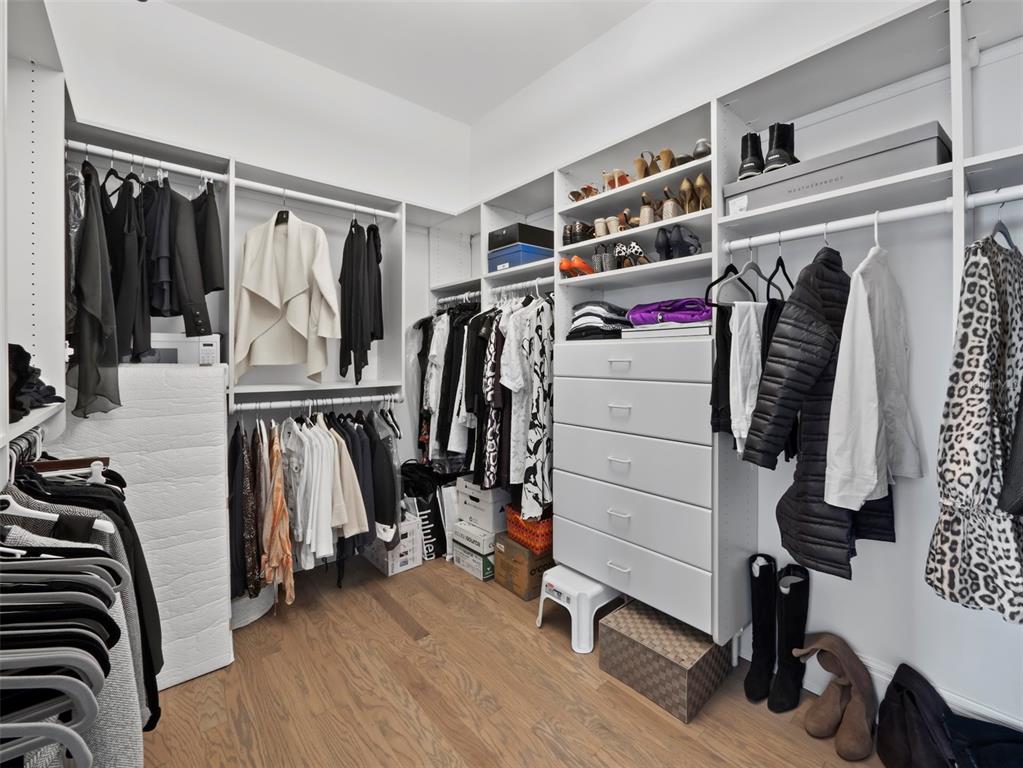 65 Lighthouse Point Drive Longboat Key, FL 34228 - Photo 52 of 90 a view of walk in closet with clothes and shoes