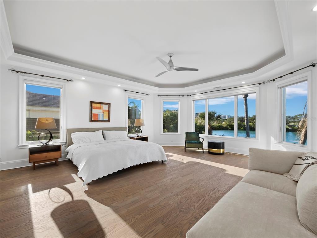 65 Lighthouse Point Drive Longboat Key, FL 34228 - Photo 53 of 90 a living room with furniture and a large window