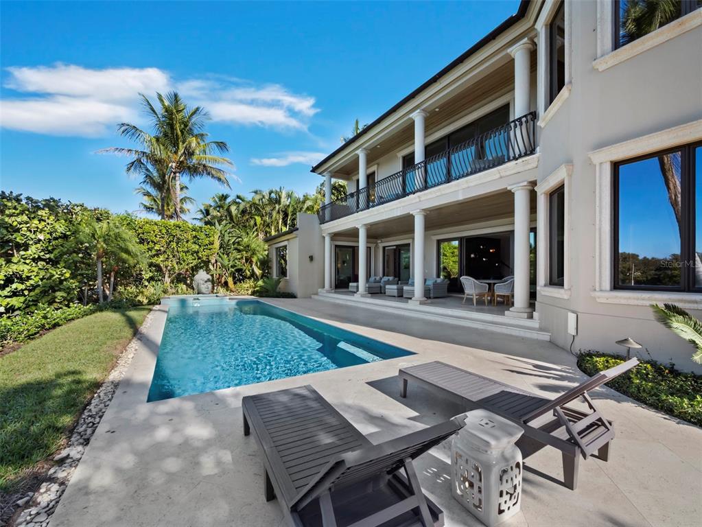 65 Lighthouse Point Drive Longboat Key, FL 34228 - Photo 61 of 90 a view of a house with a patio