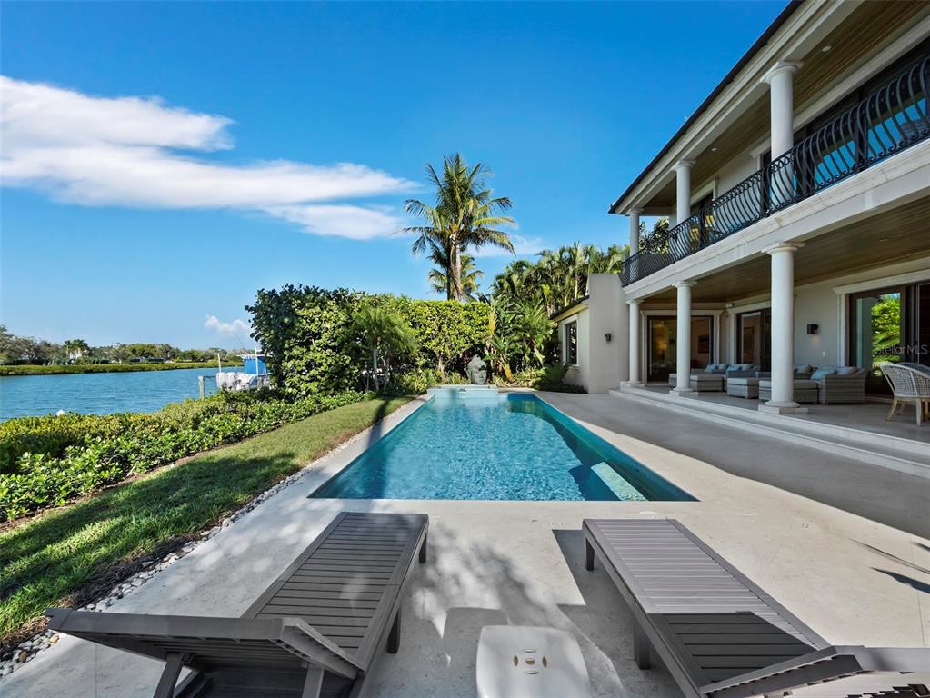 65 Lighthouse Point Drive Longboat Key, FL 34228 - Photo 62 of 90 a picture of a yard with plants