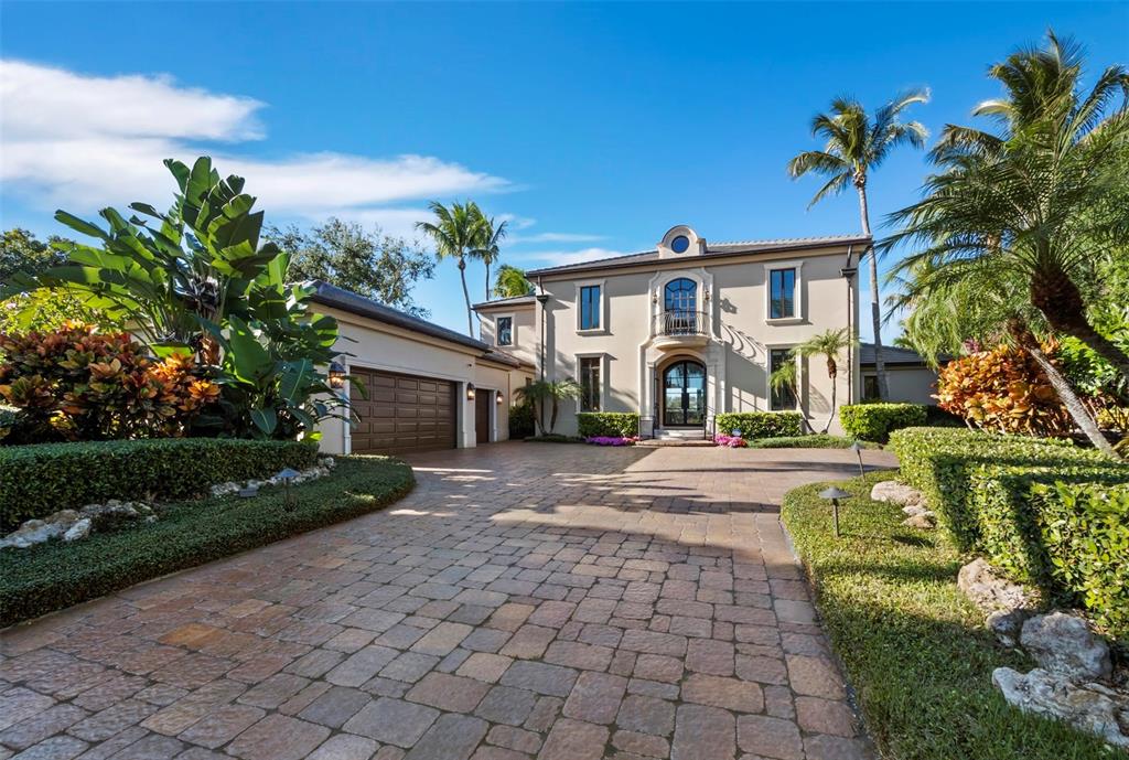 65 Lighthouse Point Drive Longboat Key, FL 34228 - Photo 73 of 90 a front view of a house with a yard