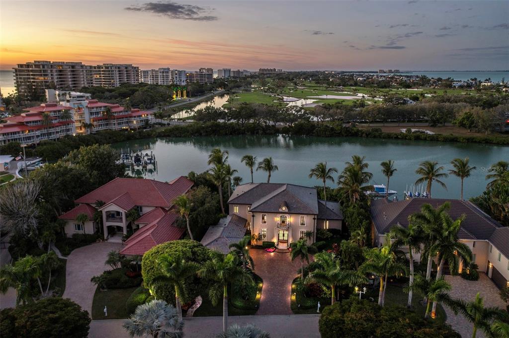 65 Lighthouse Point Drive Longboat Key, FL 34228 - Photo 76 of 90 an aerial view of lake and city
