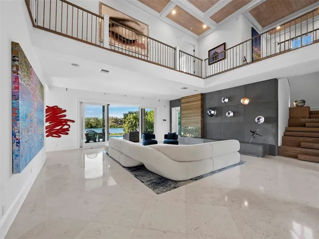 a kitchen with a sink and view of living room