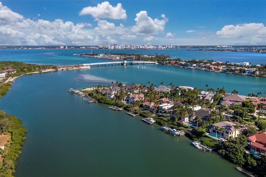 65 Lighthouse Point Drive Longboat Key, FL 34228 - Photo 86 of 90 a view of a lake with a city