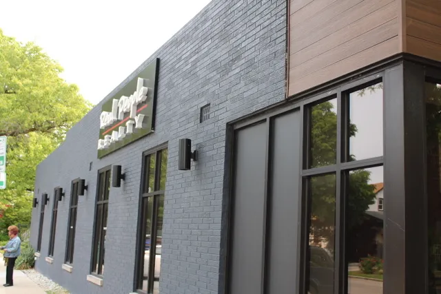 a view of a brick house with a large window