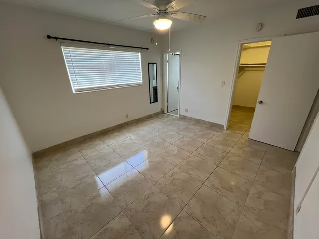 a view of an empty room with a window
