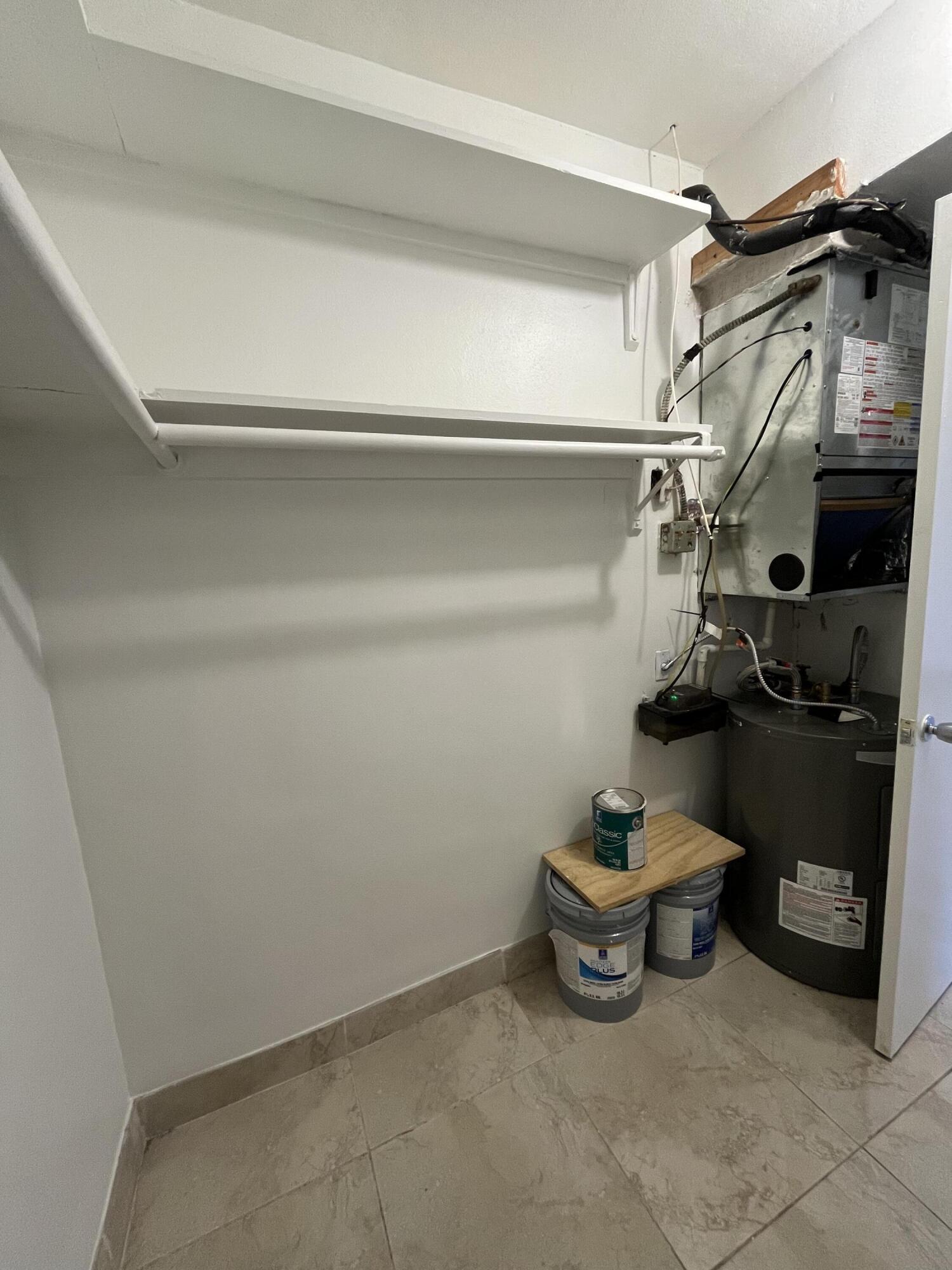 3220 Northeast 10th Street, Unit 4 Pompano Beach, FL 33062 - Photo 17 of 20 a utility room with lot of items