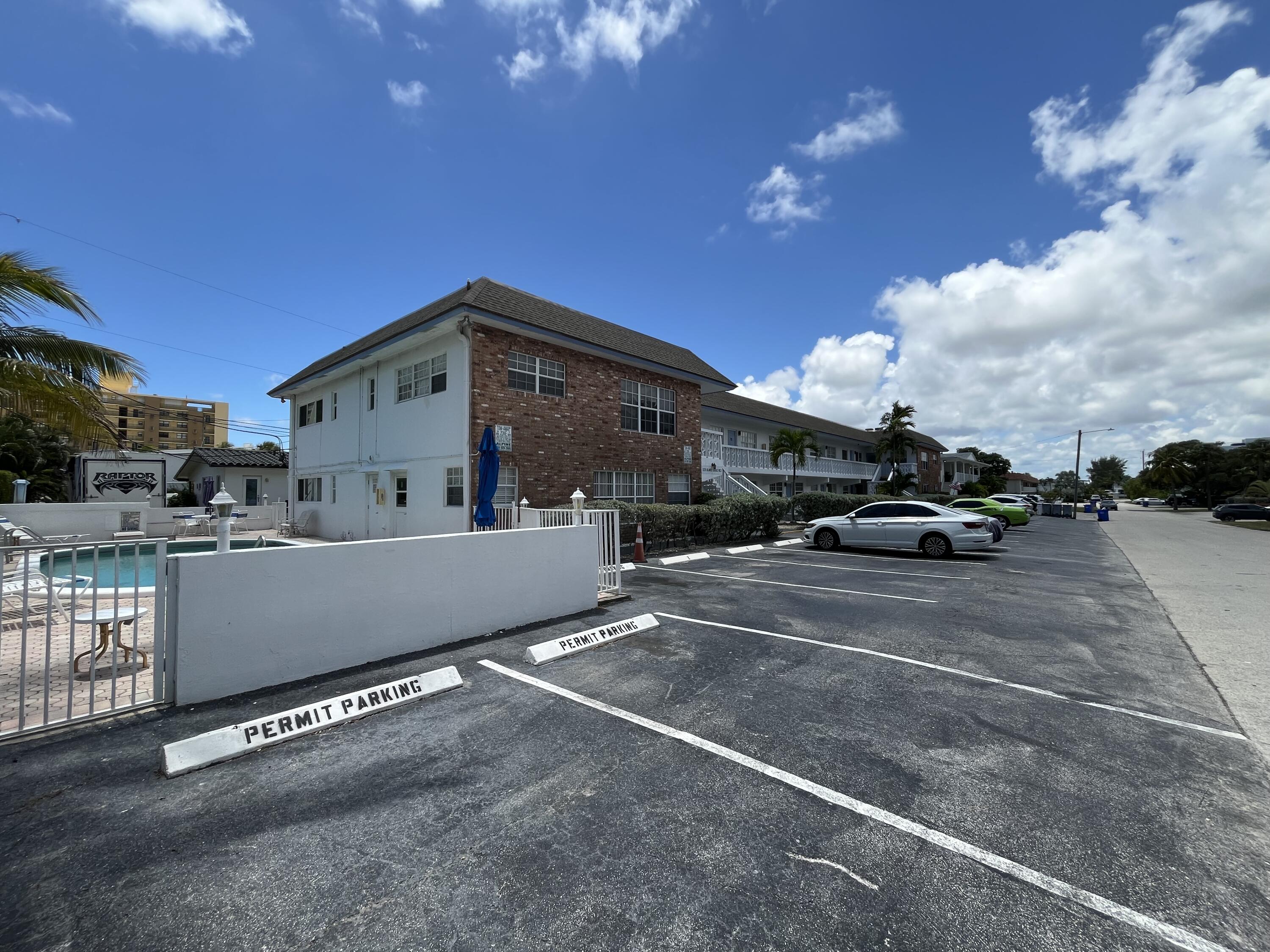 3220 Northeast 10th Street, Unit 4 Pompano Beach, FL 33062 - Photo 20 of 20 a view of street with parked cars